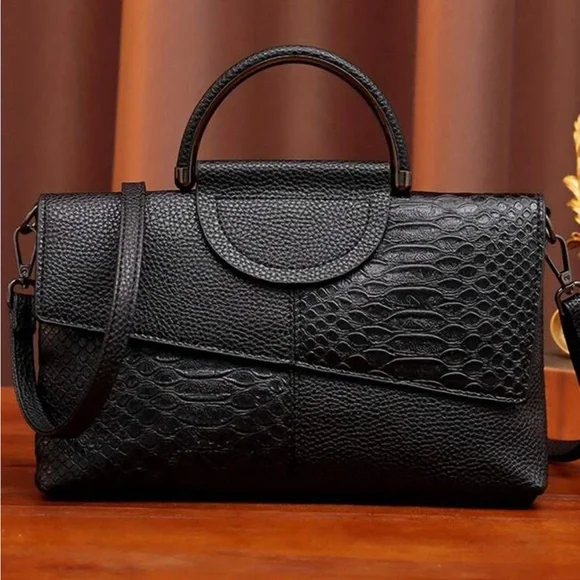 Black snakeskin print vegan leather clutchcrossbody bag